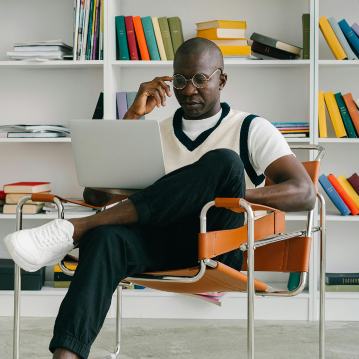 Man in front of books